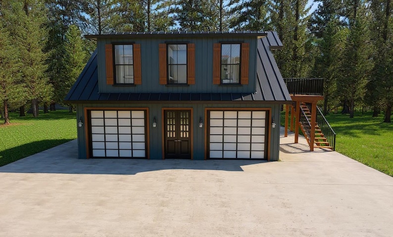 May include: A two-story building with a dark blue exterior, three windows with brown shutters, and two garage doors with a grid pattern. A wooden staircase leads to a small balcony. The building is surrounded by trees and a concrete driveway.