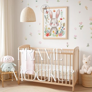 May include: A wooden cot with a white and pink patterned sheet and a pink blanket. A framed print of a bunny rabbit surrounded by flowers hangs on the wall above the cot. The wall is decorated with small flower stickers.