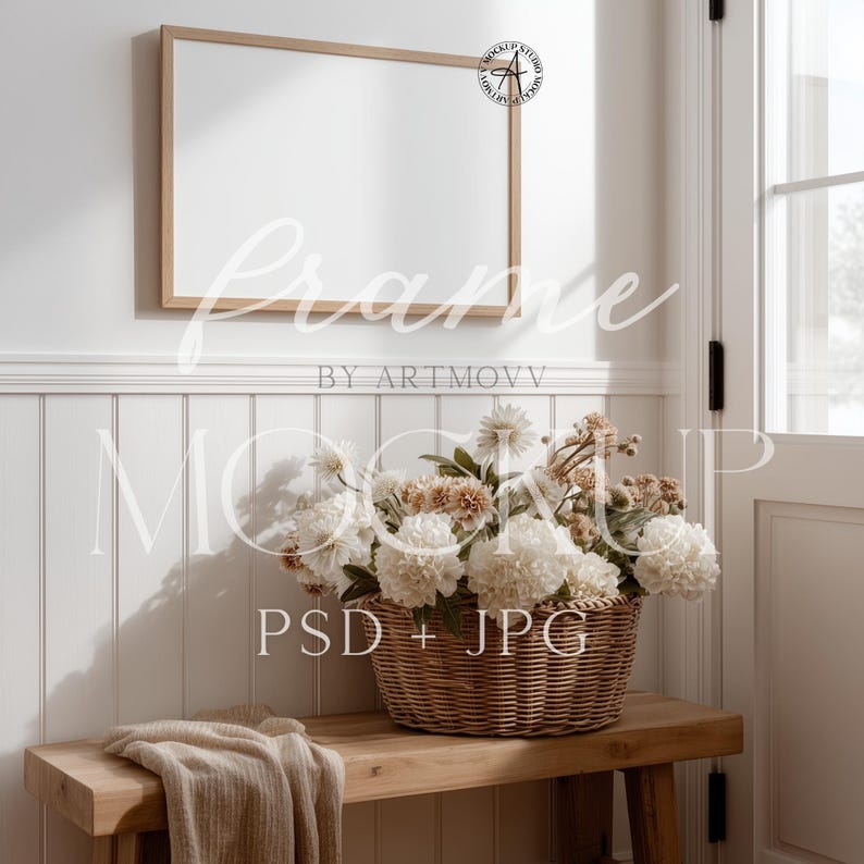 May include: A rectangular wooden frame hangs above a wooden bench with a woven basket filled with white and tan flowers. A beige blanket rests on the bench. The image includes the text "Frame" and "Mockup PSD + JPG".