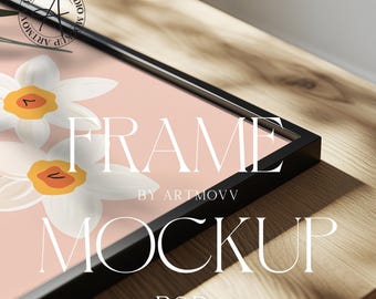 May include: A black frame mockup with a pink background and white flowers. The text "FRAME BY ARTMOVV MOCKUP PSD" is visible on the frame.