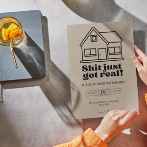 May include: A housewarming party invitation with a black and white illustration of a house and the text "Shit just got real!" Help us celebrate our new home! Friday, July 20, 2024 at 9 PM. 123 anywhere st. any city st 12345.
