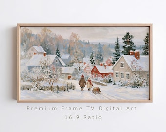 Op de afbeelding: Een rechthoekige ingelijste digitale kunstdruk met een besneeuwd dorpslandschap met twee figuren die hand in hand over een pad lopen. De scène bevat huizen met besneeuwde daken, groenblijvende bomen en een kleine houten slee die wordt voortgetrokken.