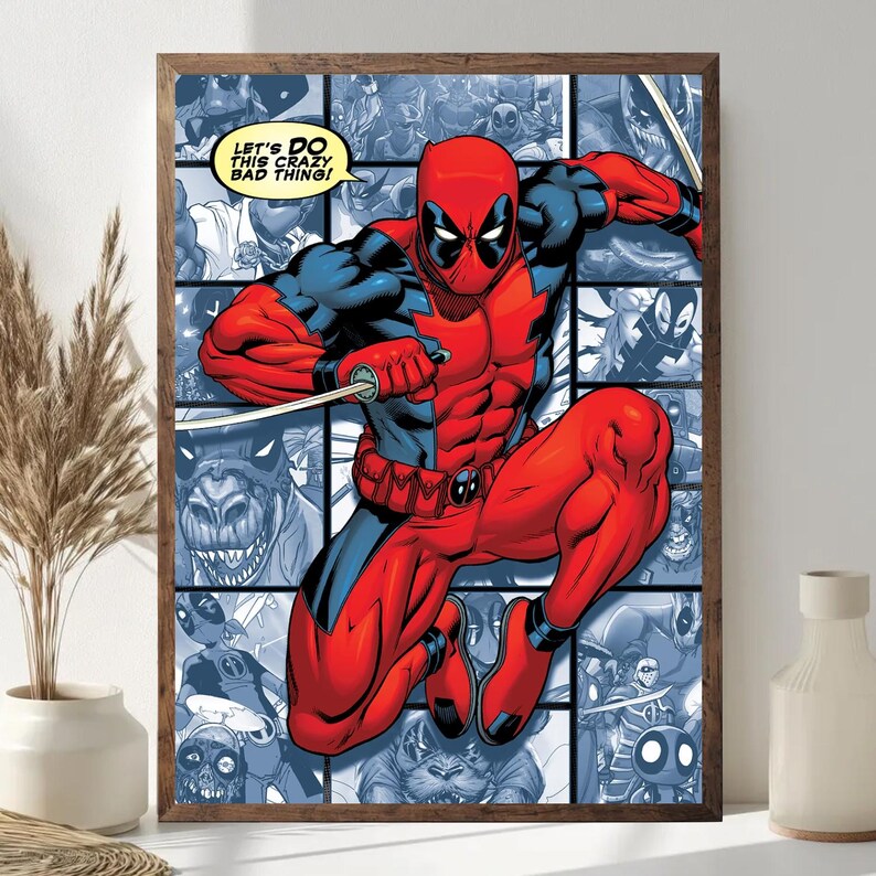 May include: Framed comic book art featuring Deadpool in a dynamic pose, clad in a red and black suit, holding a sword. The background is a collage of comic panels in shades of blue. Text in a yellow speech bubble reads, "LET'S DO THIS CRAZY BAD THING!"