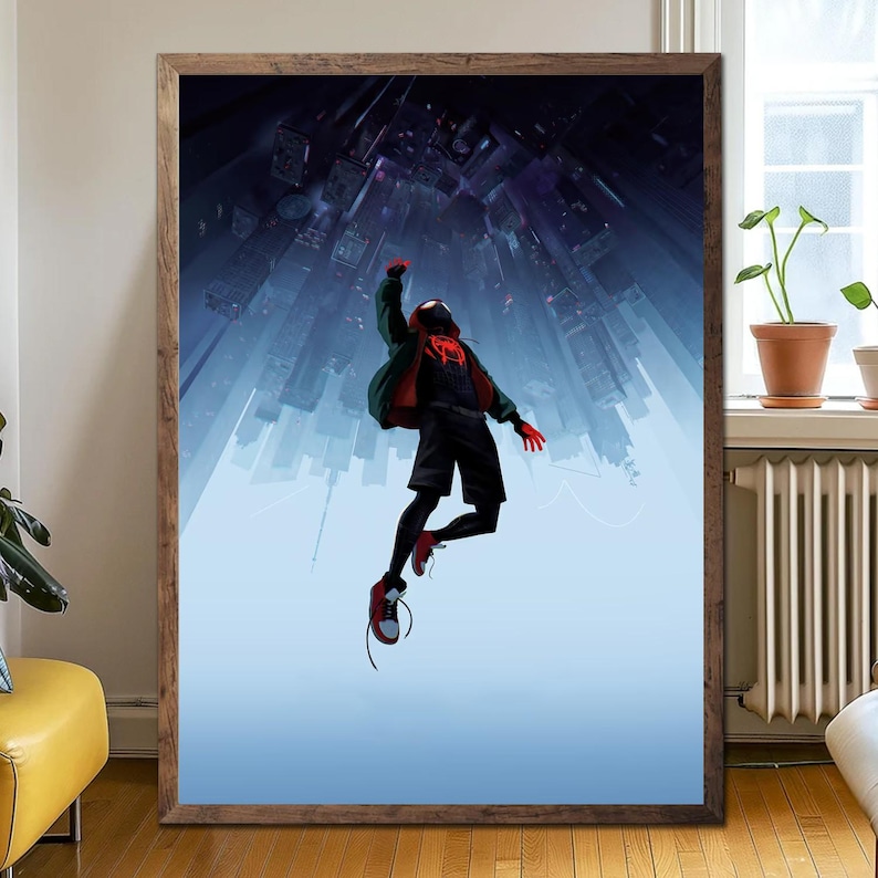 May include: A framed print featuring a superhero in a black and red suit, leaping against a backdrop of a cityscape. The artwork has a dynamic composition with a blue and purple color scheme, and is set in a wooden frame.