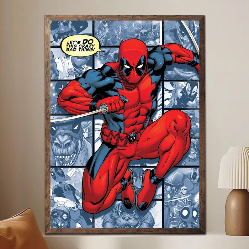 May include: A framed comic book art print featuring Deadpool in a dynamic pose, clad in a red and black suit, holding swords. The background is a collage of comic panels in shades of blue. Text in the upper left reads, "LET'S DO THIS CRAZY BAD THING!"