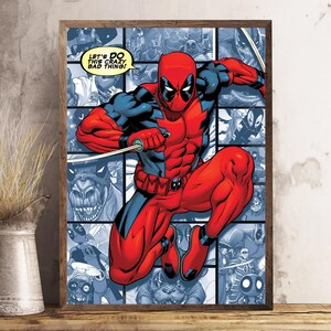 May include: A framed comic book art print featuring Deadpool in a dynamic pose, clad in a red and black suit. The background is a collage of comic panels in shades of blue. Text in the image reads, "LET'S DO THIS CRAZY BAD THING!"