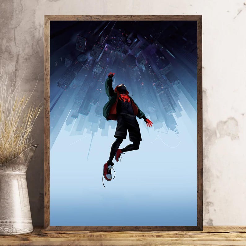 May include: Framed artwork featuring a superhero in a black and red suit, mid-air against a backdrop of a cityscape. The artwork has a blue and purple color scheme, with the superhero's pose suggesting dynamic movement.
