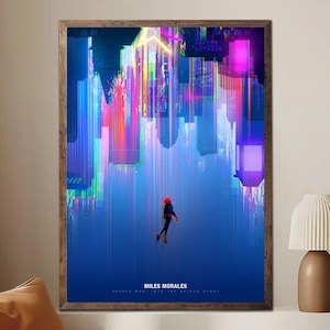 May include: A framed art print featuring a vibrant, upside-down cityscape with neon colors. A figure in a red and black suit is falling. The print includes the text "Miles Morales" and "Spider-Man Into the Spider-Verse".