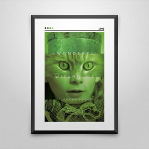 May include: A green and white poster with the text "The Wonderful Wizard of Oz" and the year "1900". The poster features a close-up of a child's face with a cat's eyes and nose.