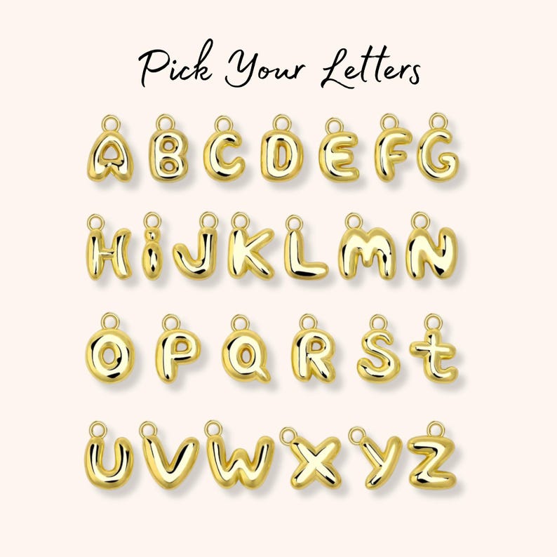 May include: A collection of gold-toned, three-dimensional, puffy-style alphabet letter charms, each featuring a small circular jump ring at the top for attachment. The text "Pick Your Letters" is displayed in a black script font above the charms.