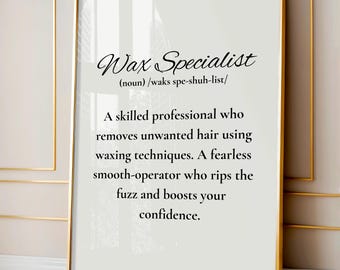 May include: A rectangular wall art print in a thin gold frame featuring black text on a white background. The text defines a Wax Specialist as a skilled professional who removes unwanted hair using waxing techniques and boosts confidence.