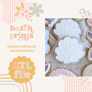 May include: Close-up of seashell-shaped cookies with white and purple icing. The cookies are decorated with the name "Malani" and the number "7". The image also includes the text "batch prints" and "STL file".