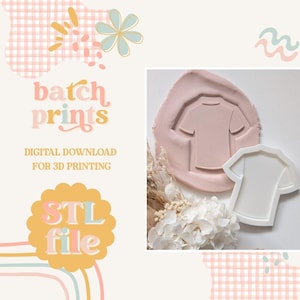 May include: A pink t-shirt shaped cookie cutter and a t-shirt imprint in pink dough. The image includes the text "batch prints" and "STL file" with the words "Digital Download for 3D Printing". The background has a floral and pastel design.