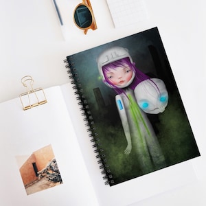 May include: A white and green illustration of a girl wearing a white helmet and a white spacesuit. She has purple hair and blue eyes. She is holding a white skull with blue eyes. The background is a dark green.