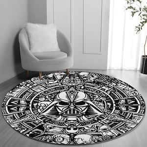 May include: Black and white round rug with a circular design featuring a Darth Vader character in the center. The rug has a detailed pattern of geometric shapes and symbols.