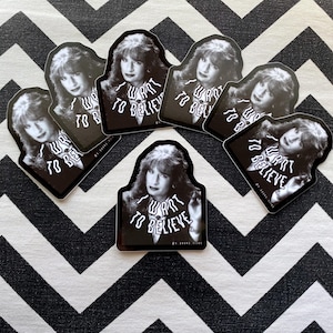 May include: Set of six black and white stickers featuring a woman with the text "I want to believe" repeated multiple times.