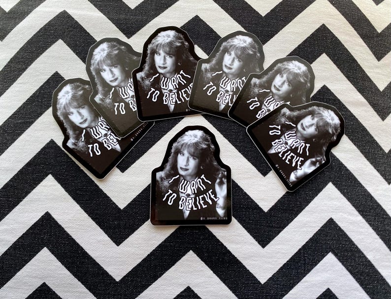 May include: Set of six black and white stickers featuring a woman with the text "I want to believe" repeated multiple times.