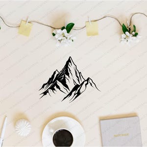 May include: A black and white mountain range graphic. The image features a stylized illustration of a mountain range, with sharp peaks and valleys. The design is simple and modern, suitable for various applications.