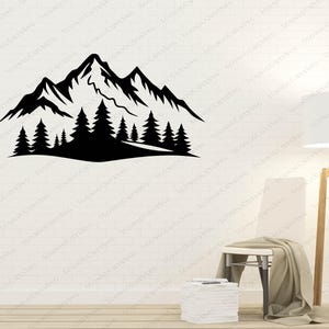 May include: Black mountain and forest silhouette wall decal. The design features a mountain range with several pine trees in the foreground. The decal is a simple, yet elegant, nature-themed design.