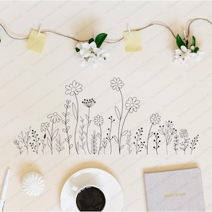 May include: A black and white line drawing of a row of wildflowers with stems and leaves. The flowers are stylized and simple.