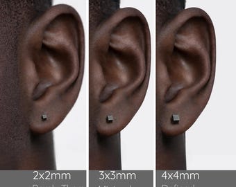 May include: Three square-shaped stud earrings in a dark matte finish, shown in sizes 2x2mm, 3x3mm, and 4x4mm. Each earring is displayed on an earlobe, with text labels indicating the dimensions and descriptive terms for each size.