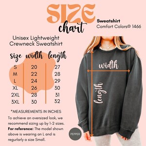 May include: A size chart for a unisex lightweight crewneck sweatshirt. The chart displays measurements in inches for sizes S through 3XL. The sweatshirt is a dark gray color, and the text "SIZE chart" is in an orange script font.