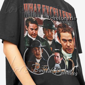 Puede incluir: Camiseta negra con un diseño vintage que presenta un collage de actores y el texto "WHAT EXCELLENT" en rojo y "Boiled Potatoes". El diseño tiene un aspecto envejecido.