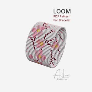 May include: A beaded bracelet with a floral pattern in pink, yellow, and white. The bracelet is cylindrical and features the text "LOOM PDF Pattern For Bracelet". The design is by ArtLoom Patterns.