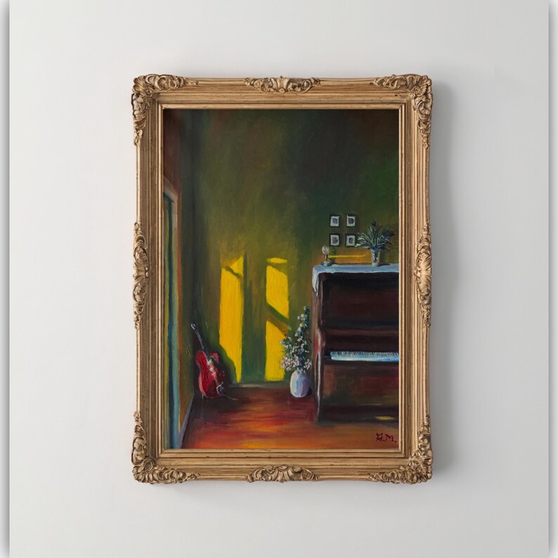 May include: Oil painting of a room with a piano, guitar, and vase of flowers. The painting is in a gold ornate frame. The room has a warm, inviting feel with sunlight streaming through a window.