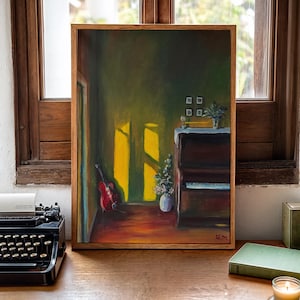 May include: A framed painting of a room interior with a red guitar, piano, and vase of flowers. The artwork features a warm color palette with sunlight streaming through a window. The painting is in a wooden frame.