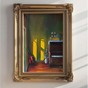 May include: An oil painting in a gold ornate frame depicts a room with a piano, guitar, and vase of flowers. Sunlight streams through a window, illuminating the room. The painting has a warm color palette with a vintage aesthetic.
