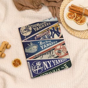 May include: A rectangular, multi-colored New York Yankees design. The design features the team's logo, the words "New York Yankees", and baseball-themed graphics. The color scheme includes navy blue, white, and red.