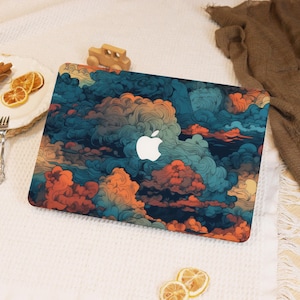 May include: A laptop skin with a colourful abstract design of swirling clouds in shades of blue, orange, and red. The design features a white Apple logo in the centre.