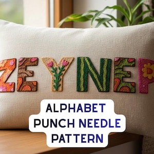 Puede incluir: Un cojín rectangular beige con el nombre "ZEYNEP" bordado en letras coloridas y estampadas. Las letras son naranjas, verdes, rosas y amarillas. El texto en la imagen dice "ALPHABET PUNCH NEEDLE PATTERN".