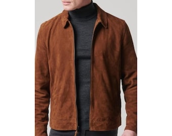 May include: A brown suede jacket with a zipper closure. The jacket has a stand-up collar and a relaxed fit.