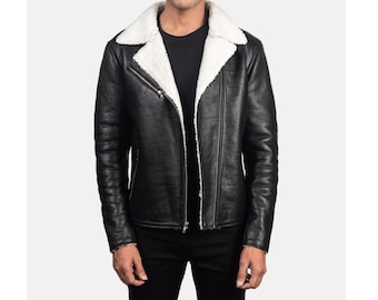 May include: A black leather jacket with a white shearling collar and lining. The jacket has a zipper closure and two pockets on the front.