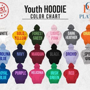 May include: Color chart for youth hoodies showing 18 different colors. The colors include white, gold yellow, forest green, light pink, dark heather, orange, Carolina blue, navy, mardon, black, orchid, sport grey, royal blue, purple, heliconia, Irish green, and red.