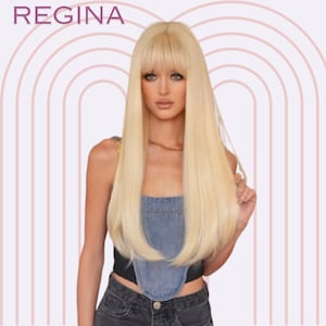 May include: A woman with long, straight, blonde hair and bangs wearing a denim top and black jeans. The background is a pink and white striped pattern.
