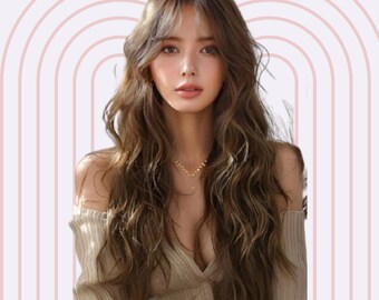 May include: A woman with long, wavy brown hair wearing a beige off-the-shoulder sweater and a gold necklace. The background is a pink and white striped pattern.