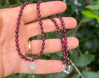 Lotus Charm Necklace with Red Garnet