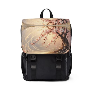 Puede incluir: Mochila negra con solapa con una impresión de arte digital de un cerezo en flor con flores rosas. La parte superior de la mochila tiene un asa negra y la parte inferior es negra con dos correas ajustables.
