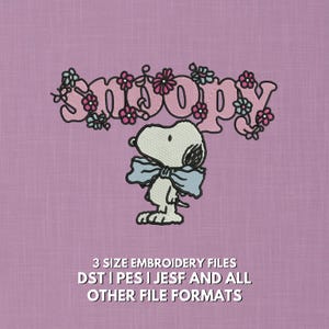 May include: An embroidered Snoopy design on a pink background. Snoopy wears a light blue bow tie, with the word "Snoopy" in pink, decorated with pink and blue flowers. The text at the bottom says "3 SIZE EMBROIDERY FILES DST | PES | JESF AND ALL OTHER FILE FORMATS."