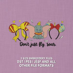 May include: An embroidered design on a lavender background features Dumbo the elephant between two Mickey Mouse ear headbands. The text "Don't just fly, soar" is below the elephant. The bottom of the image has text that reads "3 SIZE EMBROIDERY FILES DST I PES I JESF AND ALL OTHER FILE FORMATS."