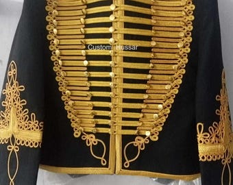 May include: A black jacket with gold trim and buttons. The jacket has a  "Custom Hussar" label on the front.