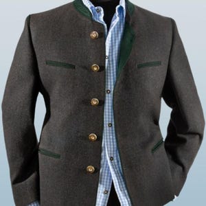 May include: A dark gray blazer with a green velvet collar and gold buttons. The blazer has a stand-up collar and two pockets.