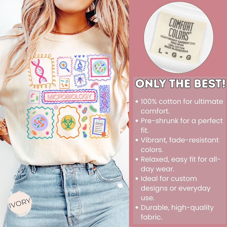 May include: Ivory-colored t-shirt featuring a colorful microbiology-themed design with various scientific illustrations and the word "MICROBIOLOGY". The shirt includes a Comfort Colors label and the text "ONLY THE BEST!"