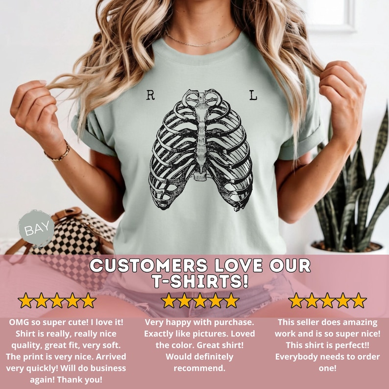 May include: A light green t-shirt featuring a black and white anatomical rib cage design. The letters "R" and "L" are printed above the rib cage. The text "CUSTOMERS LOVE OUR T-SHIRTS!" is printed below the design.