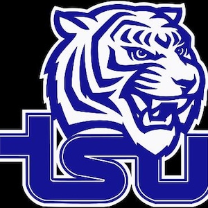 May include: A blue and white tiger head graphic with the letters "TSU" in blue and white. The tiger has a fierce expression with visible teeth and stripes. The letters are stylized and outlined in white against a black background.
