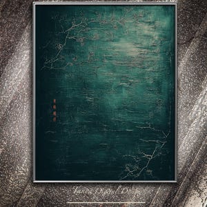 May include: Abstract teal and silver artwork in a silver frame. The textured painting features a dark teal background with silver accents resembling branches and a light area in the center. Red Asian characters are in the lower left corner.