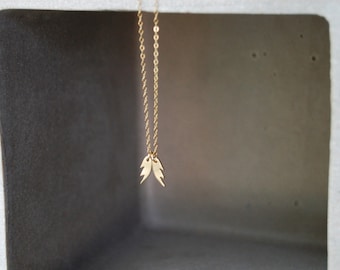 She Talk to Angels - Mini 10k Gold Angel Wings Necklace. Tiny fine gold wings with custom initials.